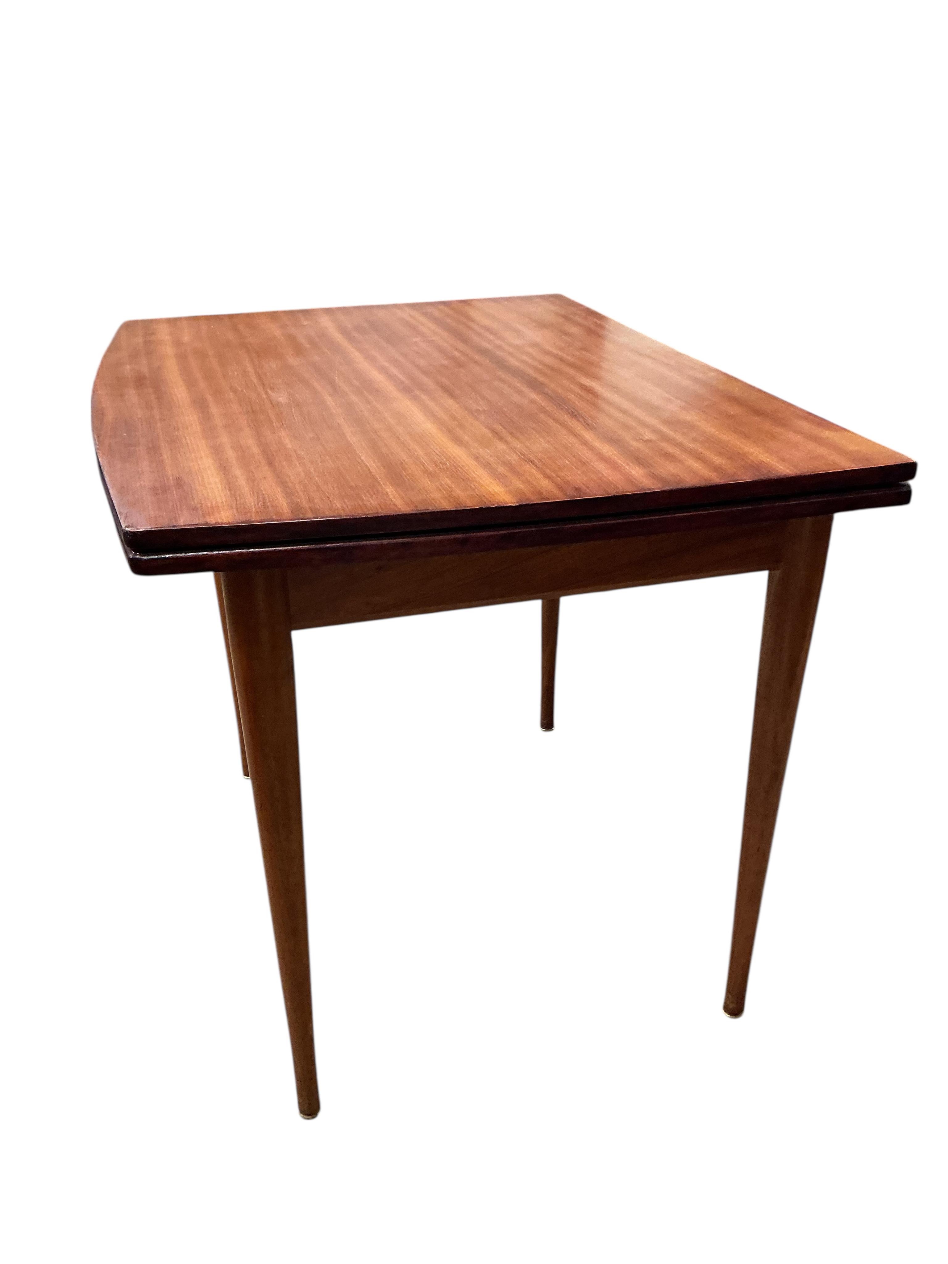 A mid century Younger teak folding, extending dining table, width 70cm, depth 90cm, height 76cm